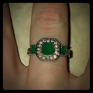 Green and silver colored ring size 8. NWOT